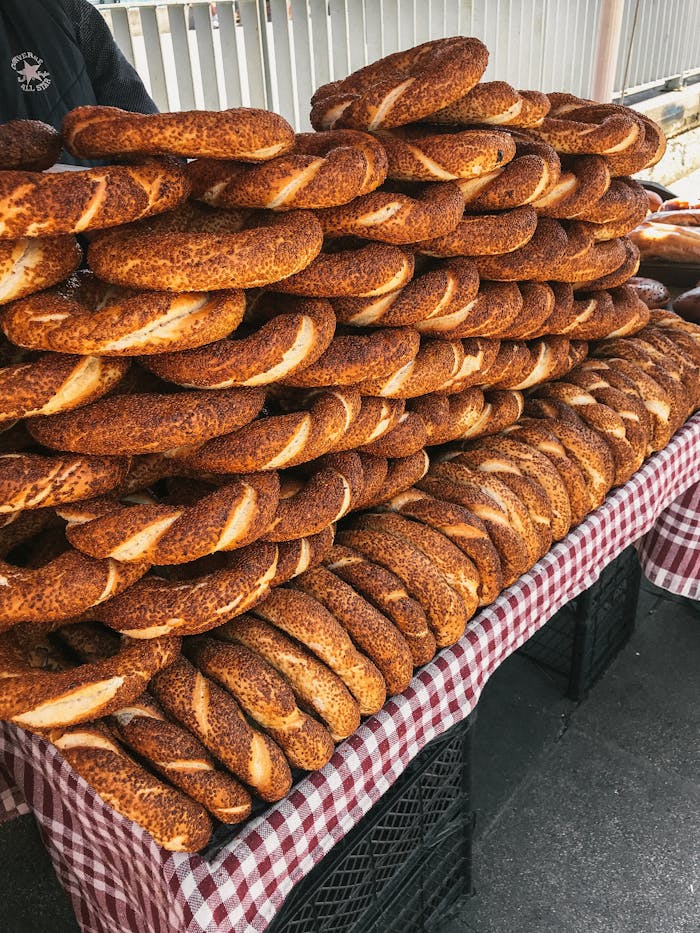 A stack of freshly baked simit rings at a market. Perfect for breakfast or as a snack.
